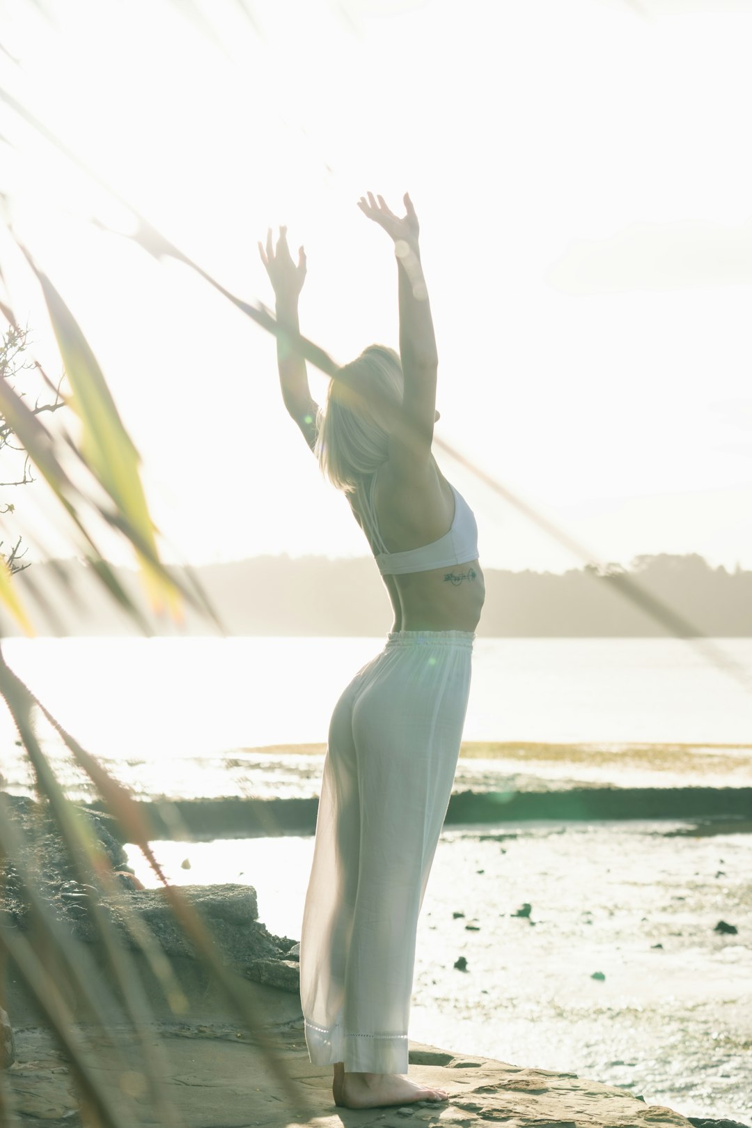 woman-standing-near-body-of-water-zdldggbi9ow